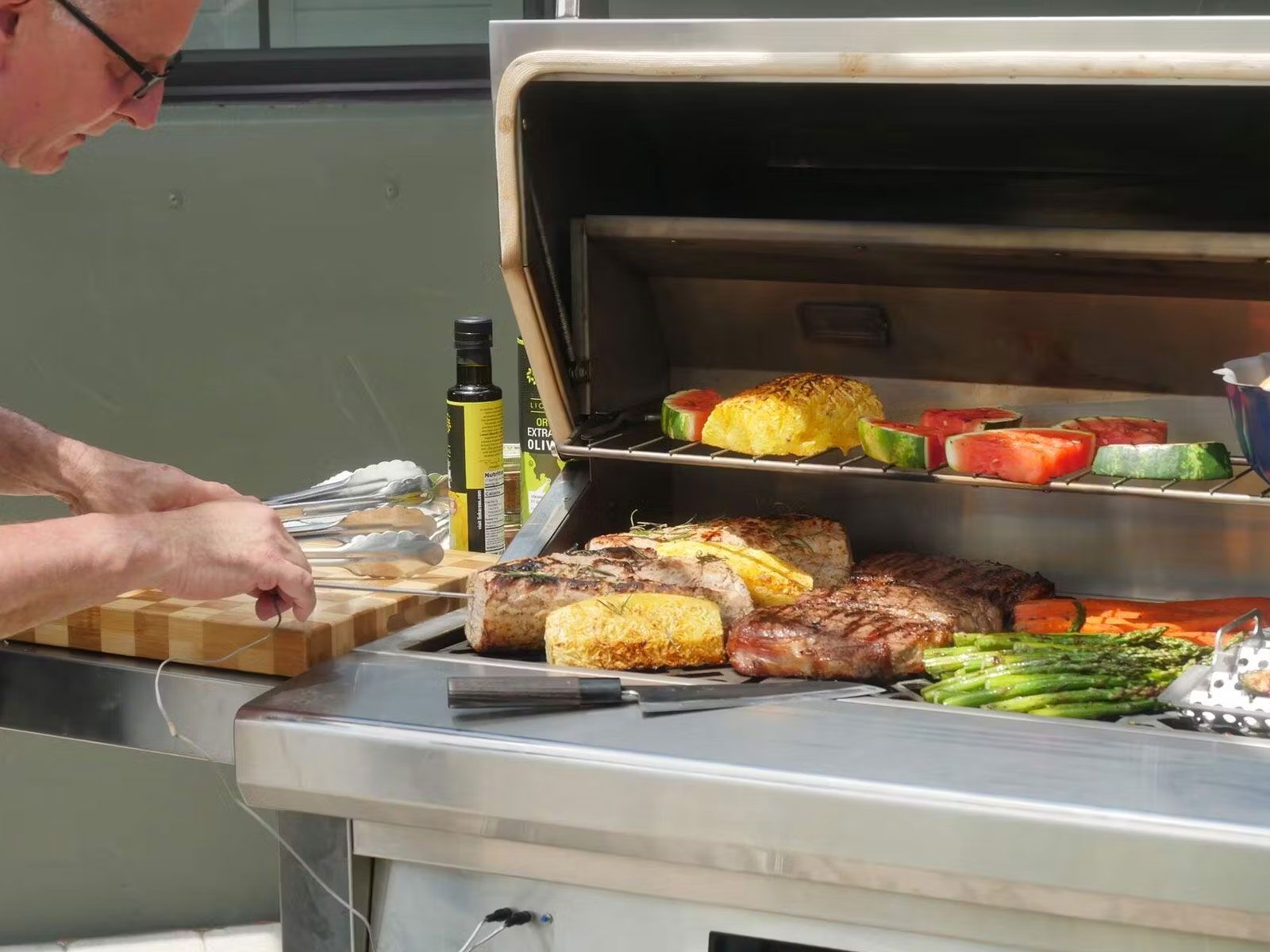 Haven 8 ft. outdoor kitchen island w/ coyote 36-inch pellet grill, single storage drawer, trash center &24-inch refrigerator - brushed black